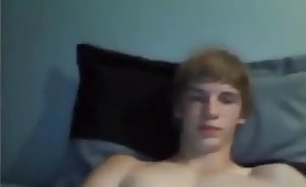 Poor quality blond boy with white armband on webcam
